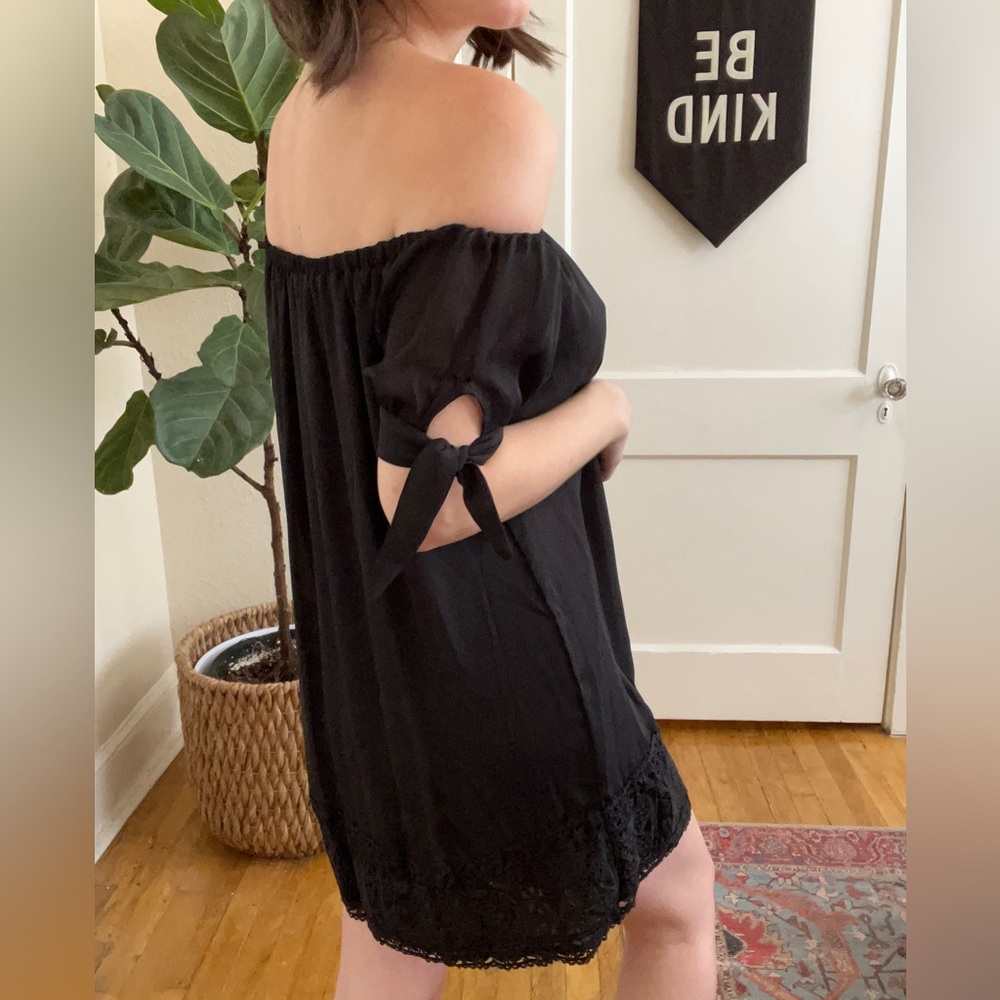black off the shoulder dress with lace bottom detail & tie sleeves